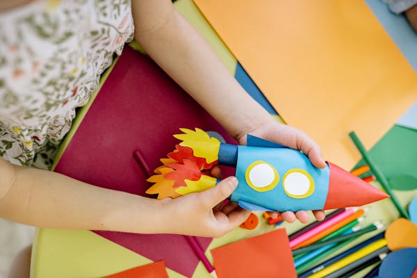 Child making a cardboard robot craft